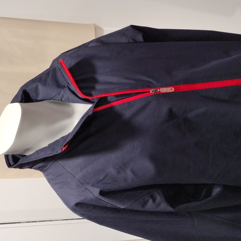 Turtleson navy blue waterproof jacket with red zippers. Mint condition. Large